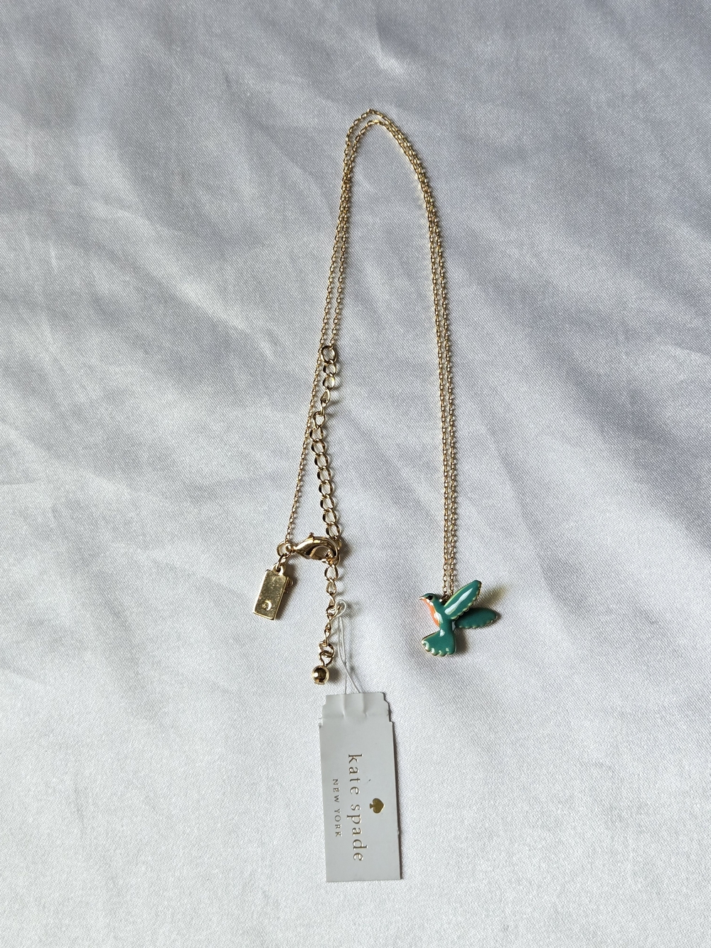 kate spade Gold Tone Necklace with Green and Pink Enamel Hummingbird Charm